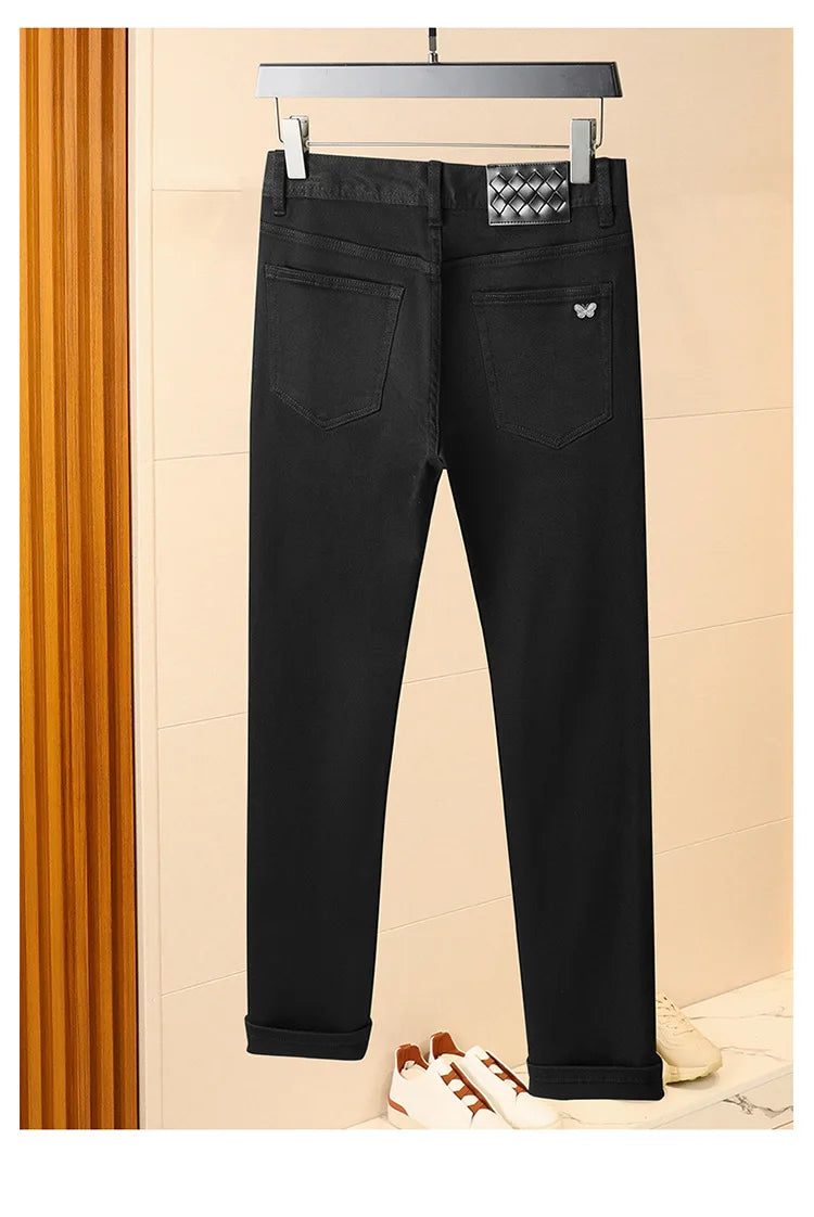 Pure black jeans men's 2025 new light luxury fashion spring and summer versatile elastic slim fit small straight leg pants